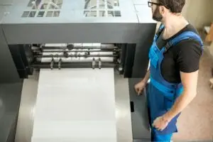 man with printing machine